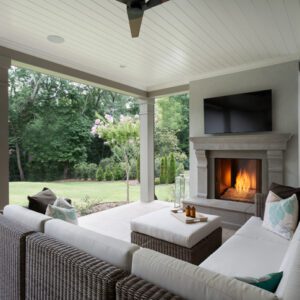 Outdoor patio with fireplace and seating area.