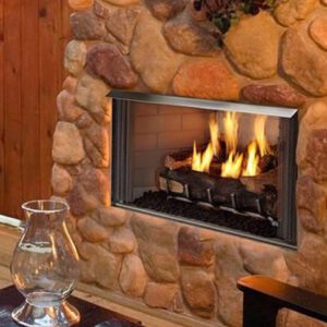 Stone fireplace with burning fire logs.