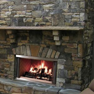 Stone fireplace with burning firewood.