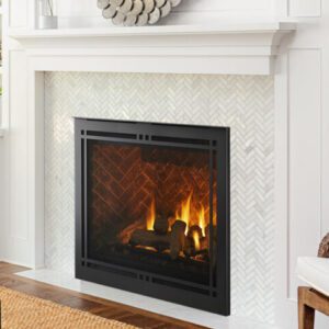 Cozy fireplace with decorative white mantel.