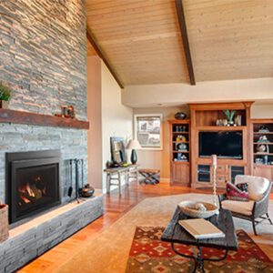 Cozy living room with stone fireplace.