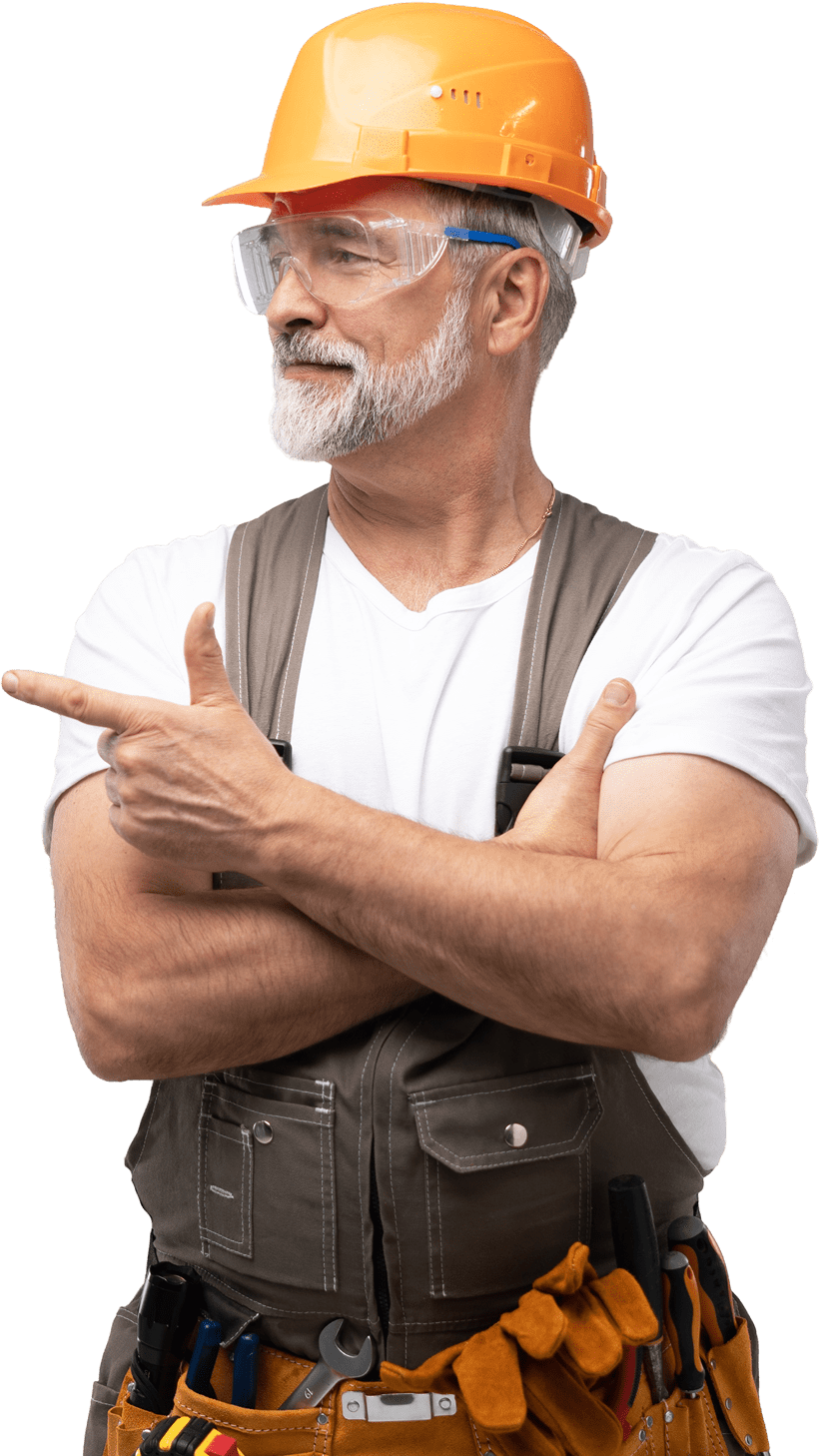 Elderly construction worker pointing, wearing safety gear.