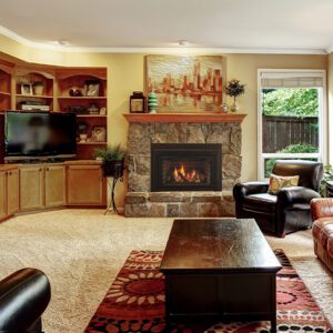 Cozy living room with stone fireplace.